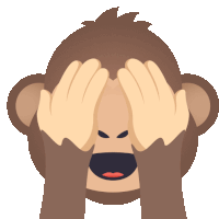 a monkey covering its eyes with its hands