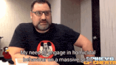 a man with glasses and a mickey mouse shirt says " my need to engage in homicidal behaviour on a massive scale