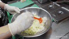 a person is mixing vegetables in a bowl with an orange spoon and the words made in animotica on the bottom right