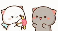 two cartoon cats are standing next to each other and one is holding a heart shaped lollipop .