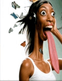 a woman with a long tongue and headphones on