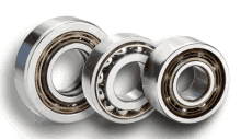 three bearings are lined up on a white surface