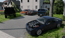 a black car with the hood up is parked in front of a white house