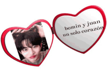 a heart shaped mirror with a picture of a man and the words bomin y juan un solo corazon