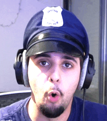 a man wearing headphones and a police hat that says special police