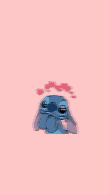 stitch is wearing sunglasses and has hearts on his head .