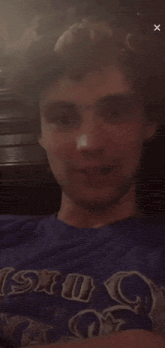 a man wearing a blue shirt that says sku