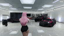 a woman with pink hair is standing in a garage with cars and a motorcycle