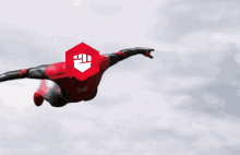 a man in a superhero costume is flying through the air with a shield on his head