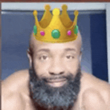 a man with a beard wearing a crown on his head .