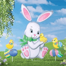 an easter bunny holding a chick in a field