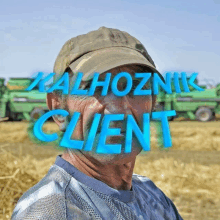 a man wearing a hat with the words kalhoznik client written on his face