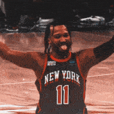 a basketball player wearing a new york jersey with the number 11 on it