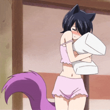 a girl with a purple tail holds a pillow