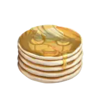 a stack of pancakes with syrup and a face on them