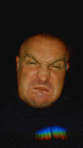 a man is wearing a t-shirt that says ' tna hoody ' on it
