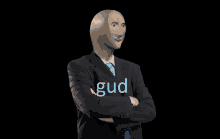 a man in a suit has the word gud written on his chest