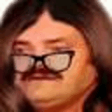 a woman wearing glasses and a mustache is making a funny face .