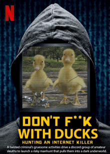 a poster for do n't f * k with ducks shows two ducklings on a screen