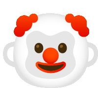 a white clown with red hair and a big smile