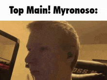 a man sitting in a chair with the words top main myronoso