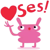 a pink monster holding a red heart with the word ses written above it