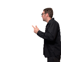 a man wearing glasses and a black shirt points to the right