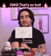 a man with a sign that says i ship it