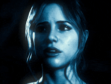 a close up of a woman 's face with a blue light behind her