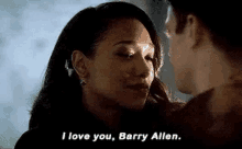 a man and a woman are looking at each other and the woman is saying `` i love you , barry allen '' .