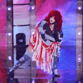a woman with red hair is dancing on a stage in a red white and blue outfit