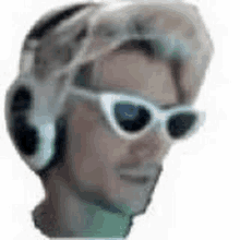 a man wearing headphones and sunglasses is making a funny face .