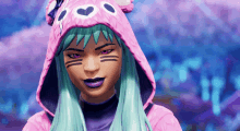 a girl with green hair and purple lips is wearing a pink hoodie with hearts on it