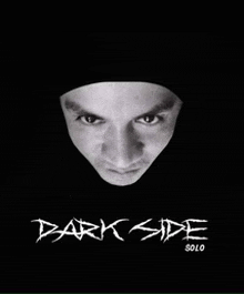 a black and white photo of a man 's face and the words dark side solo