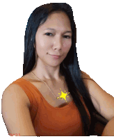 a woman with long black hair is wearing an orange tank top with a yellow star on her chest