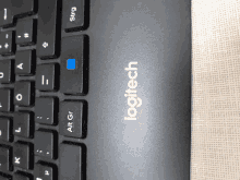 a close up of a logitech keyboard showing the alt key