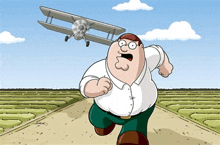 peter griffin from family guy is running down a dirt road while a plane is flying overhead .