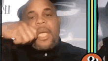 a man is making a funny face while sitting in a car with his mouth open .