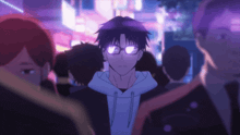 a man wearing glasses is standing in a crowd