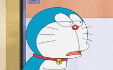 a close up of doraemon making a funny face while standing next to a door .