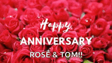 a bunch of red roses with the words `` happy anniversary rose & tom '' written on them