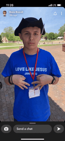 a boy wearing a shirt that says love like jesus