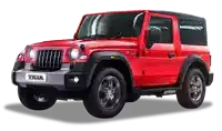 a red mahindra thar jeep with a black top