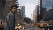 a man stands in front of a destroyed city with a taxi cab that says taxi on the side