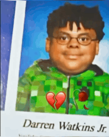 a picture of darren watkins jr. with a broken heart on his shirt