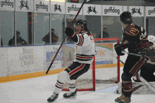 a hockey game is being played in front of a banner for bantz gosch & cremer