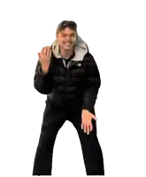 a man wearing a north face jacket is dancing