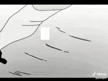 a black and white drawing of a person 's hand holding a card .