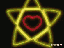 a yellow star with a red heart in the middle .