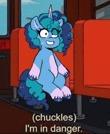 a cartoon of a unicorn sitting on a red chair with the words " chuckles i 'm in danger "